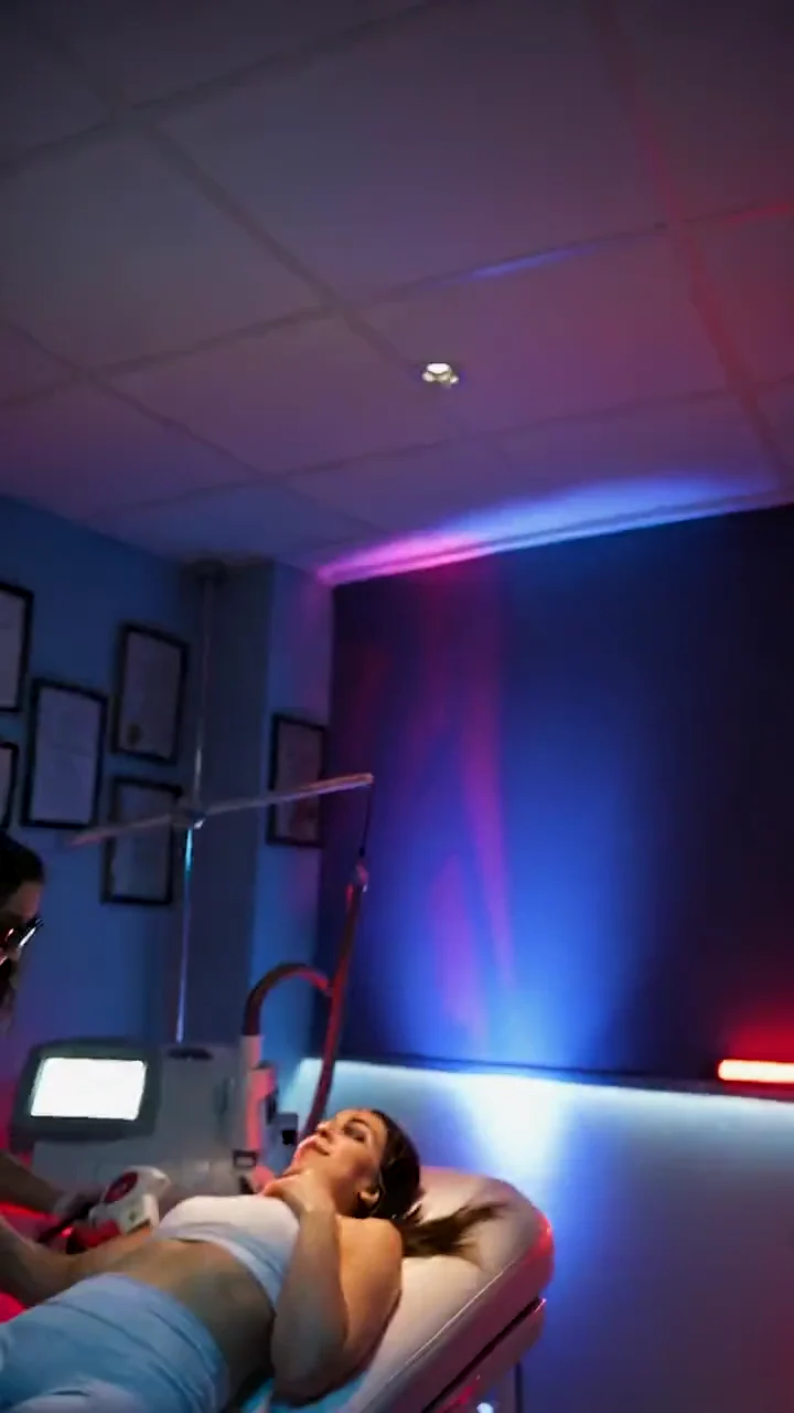 Private treatment room with the client on the bed during laser