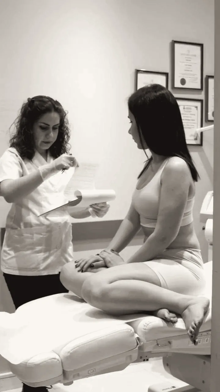Ghazaleh reviewing a treatment plan with a client during a consultation