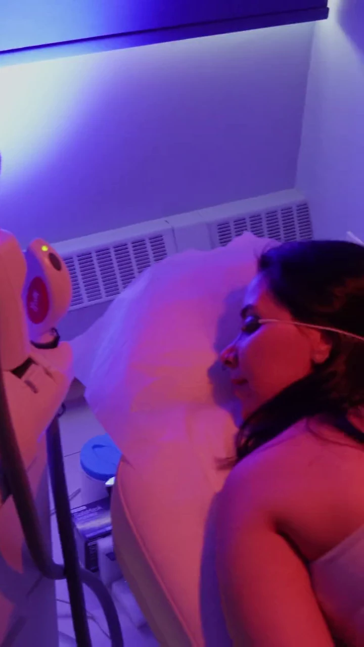 Client relaxing during a laser session at the clinic